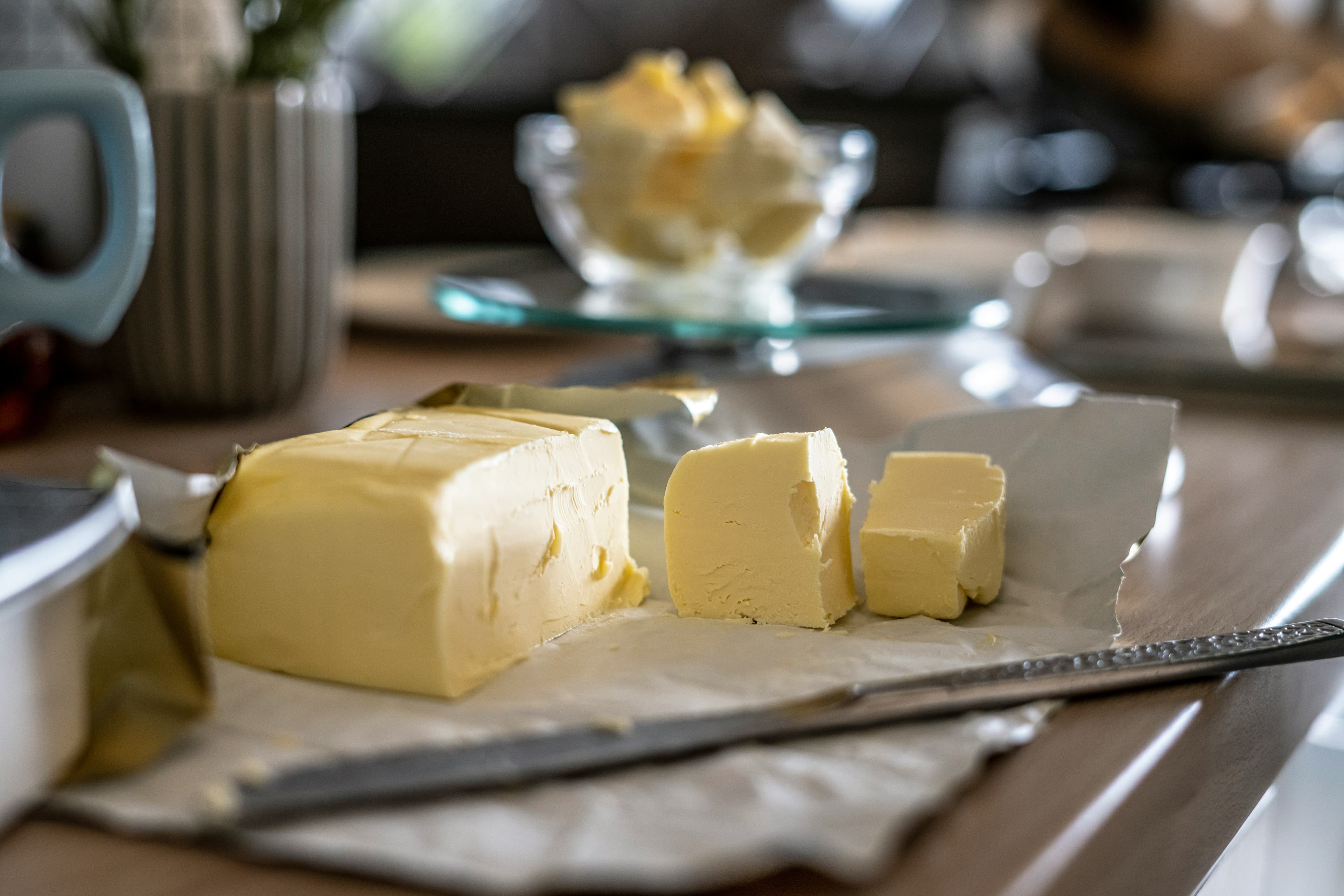 Golden homemade cultured butter on parchment paper — fermented butter recipe